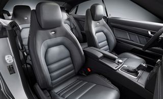 Beneath a panoramic glass sunroof, the coupe contains ample space for four