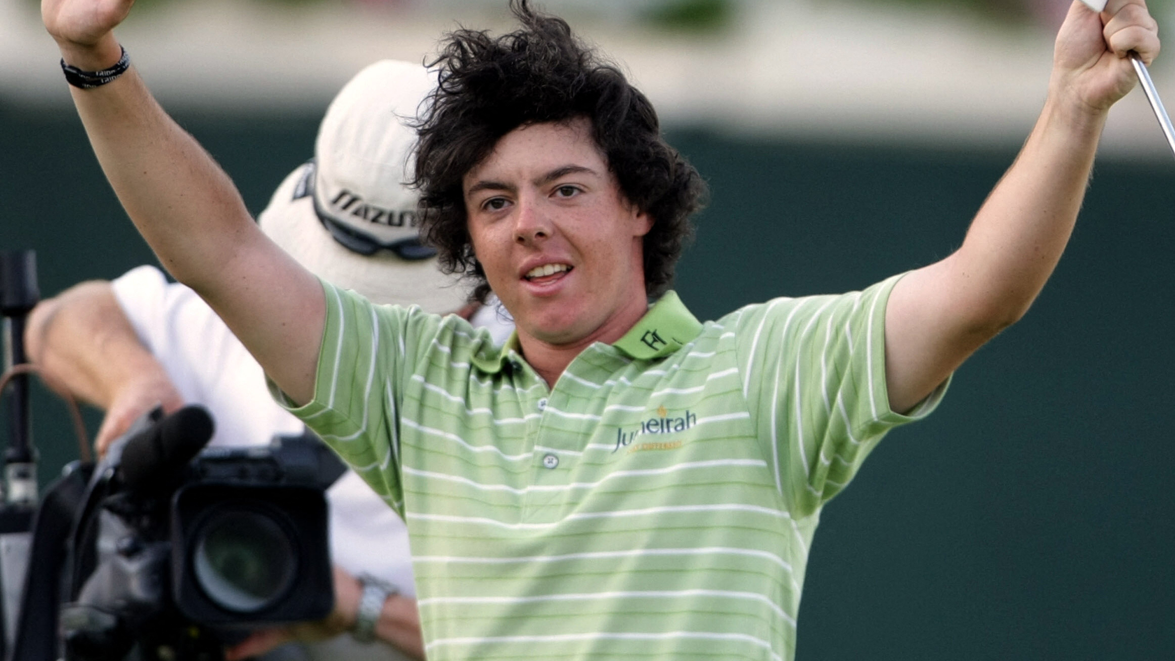 Rory McIlroy celebrates winning the Dubai Desert Classic
