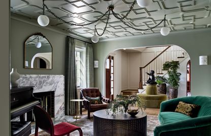 A living room with a geometric ceiling