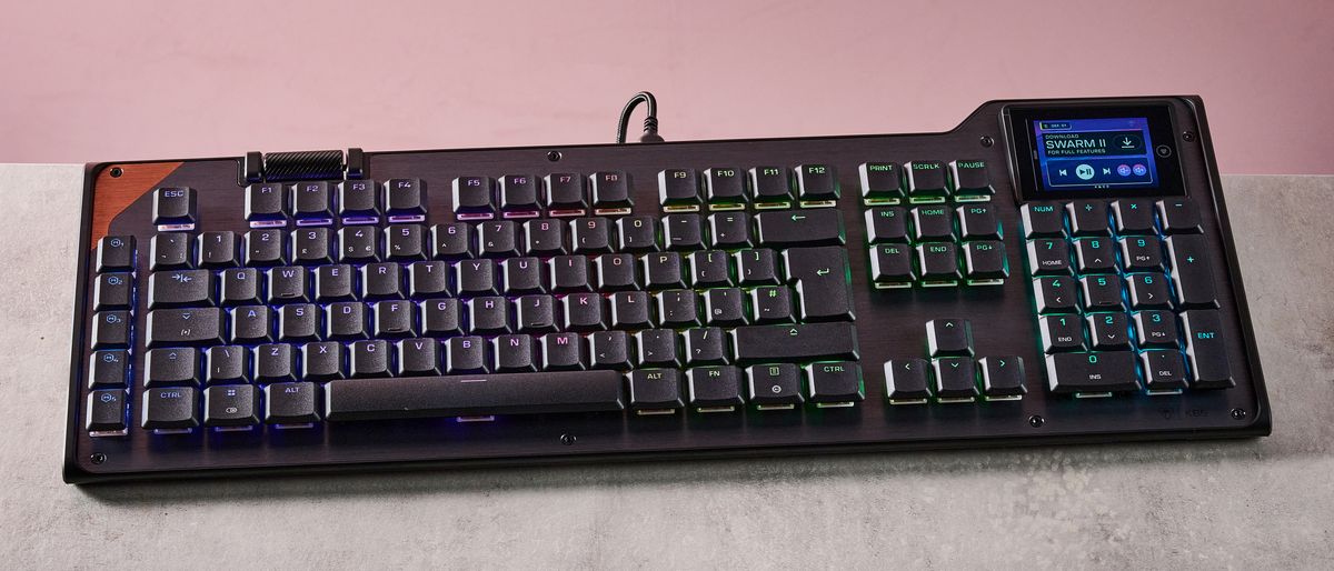 Photo of laptop, gaming console, person at computer