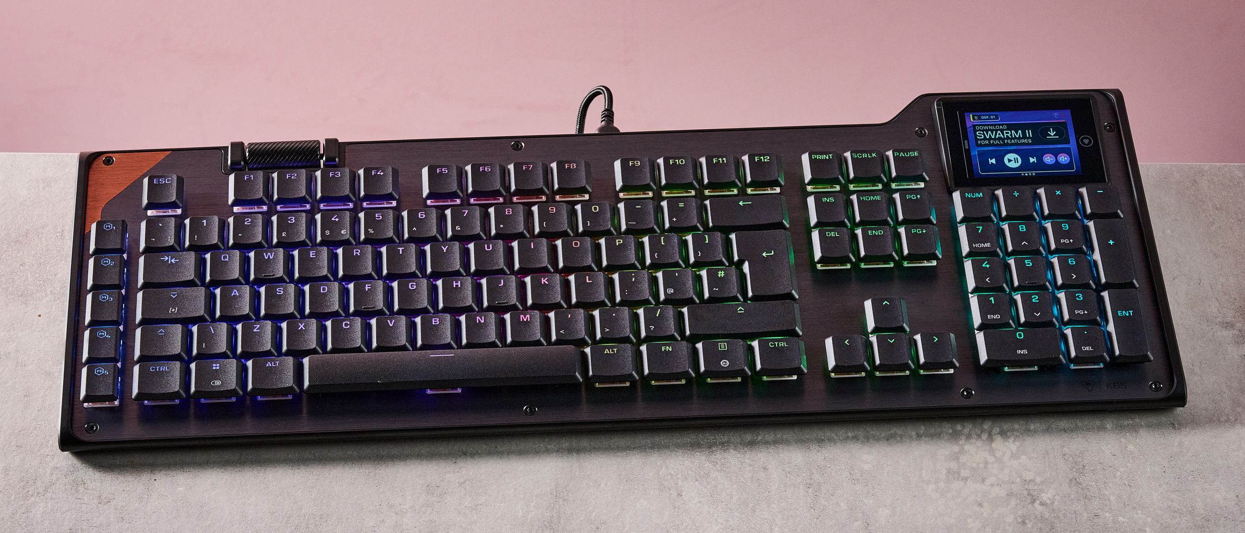 Turtle Beach Command Series KB5 on desk with pink wall in background
