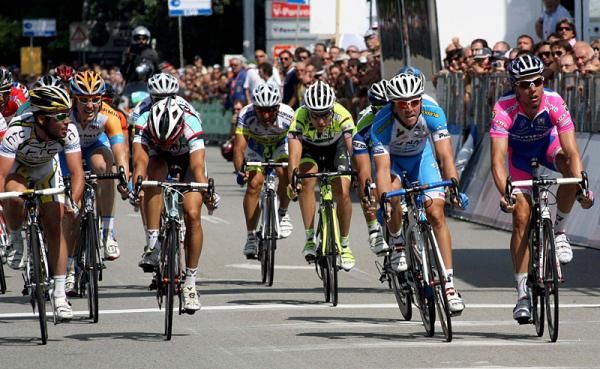 Mark Cavendish (HTC - Columbia), left, checks out the position of is sprint rivals after crossing the line.