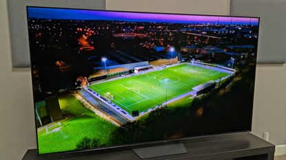 Hisense U7S Pro taken left angle shot with footage of a football training ground at night aerial shot on screen 