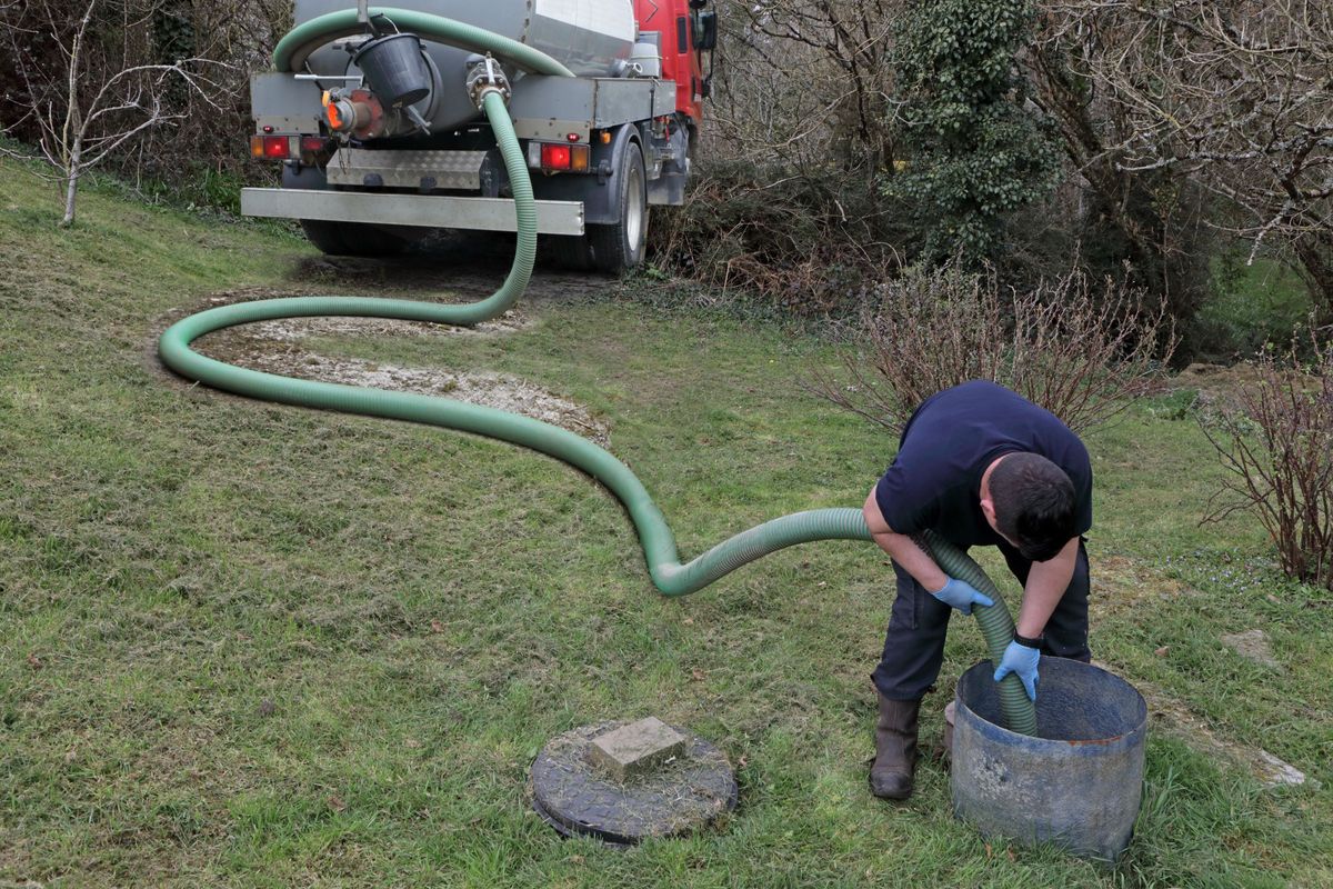 A man emptying a cesspit