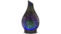 Equsupro Essential Oil Diffuser in black, with galaxy light effects