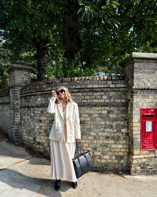 Influencer winter wishlist: @erica_davies wears a blazer and dress with boots