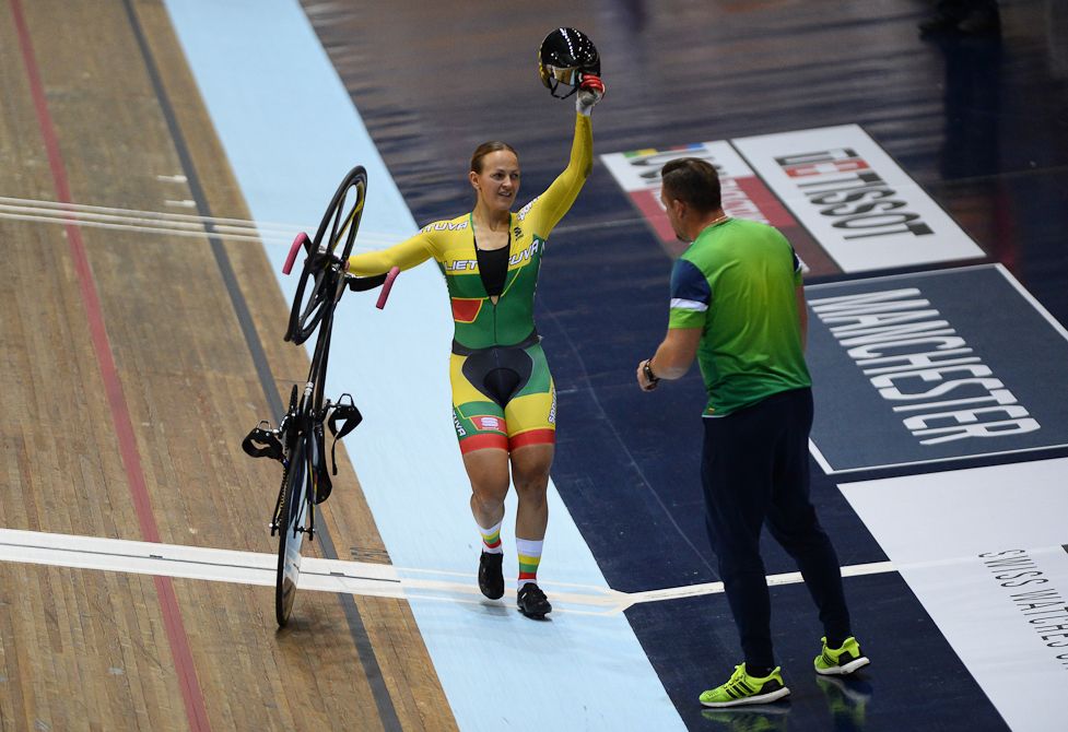 Simona Krupeckaite of Lithuanian applauds the crowd after she falls of her bike during the Women's Keirin