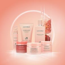 Liz Earle Glow collection on a peachy pink background