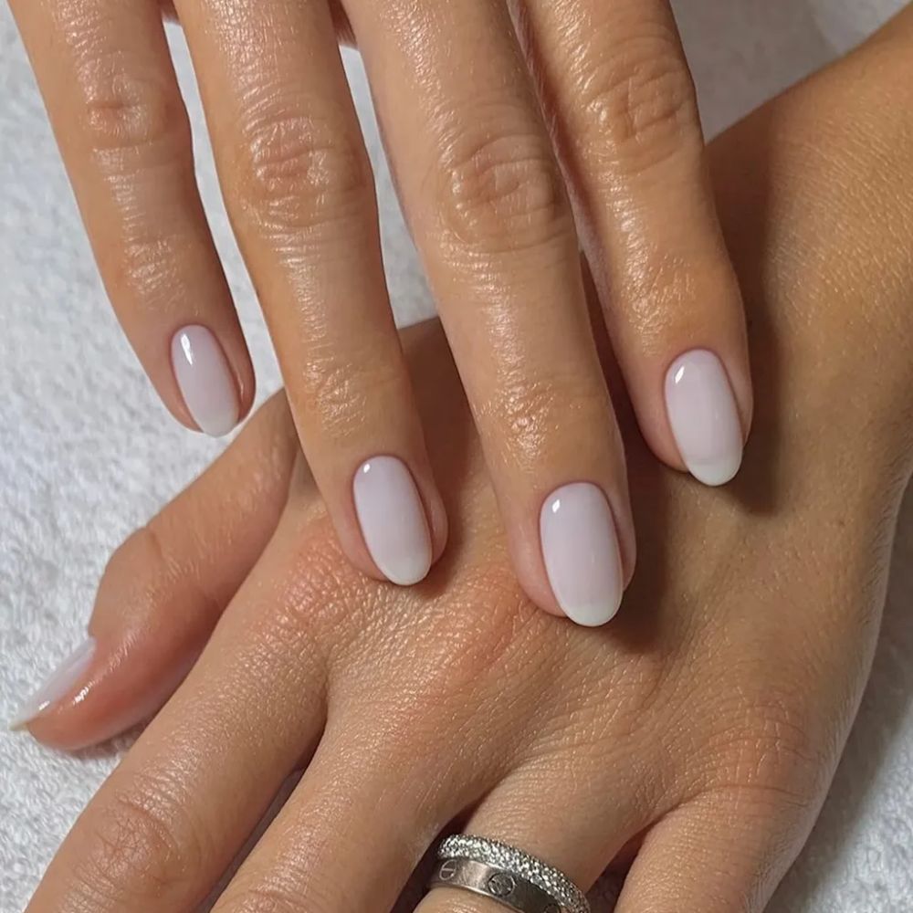An almond-shaped milky manicure