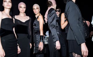 Models wear black pieces at Tom Ford S/S 2019