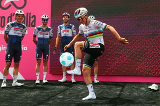 Soudal Quick Steps Belgian rider Remco Evenepoel dribbles with a ball prior to the sixth stage of the Giro dItalia 2023 cycling race 162 km between Naples and Naples on May 11 2023 Photo by Luca Bettini AFP Photo by LUCA BETTINIAFP via Getty Images