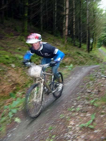 A racer whizzes past in a blur during the special stage.