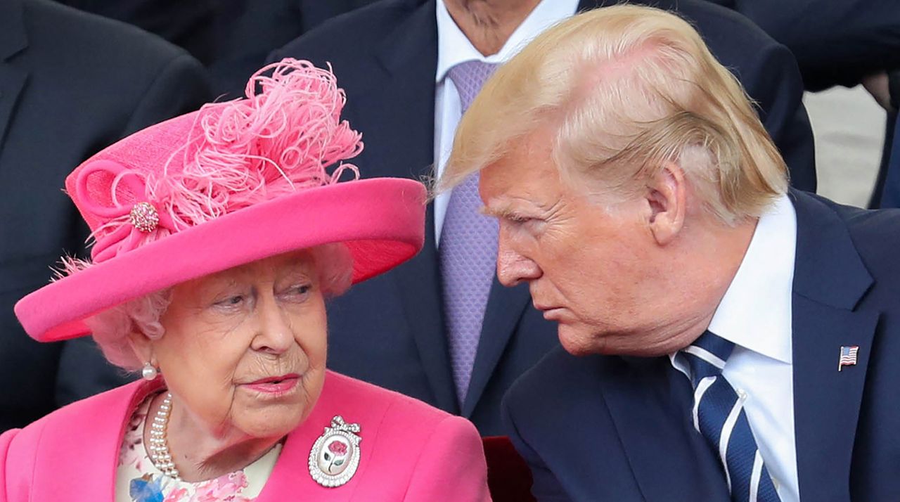 Queen Elizabeth II (L) reacts as she sits with US President Donald Trump an event to commemorate the 75th anniversary of the D-Day landings, in Portsmouth, southern England, on June 5, 2019