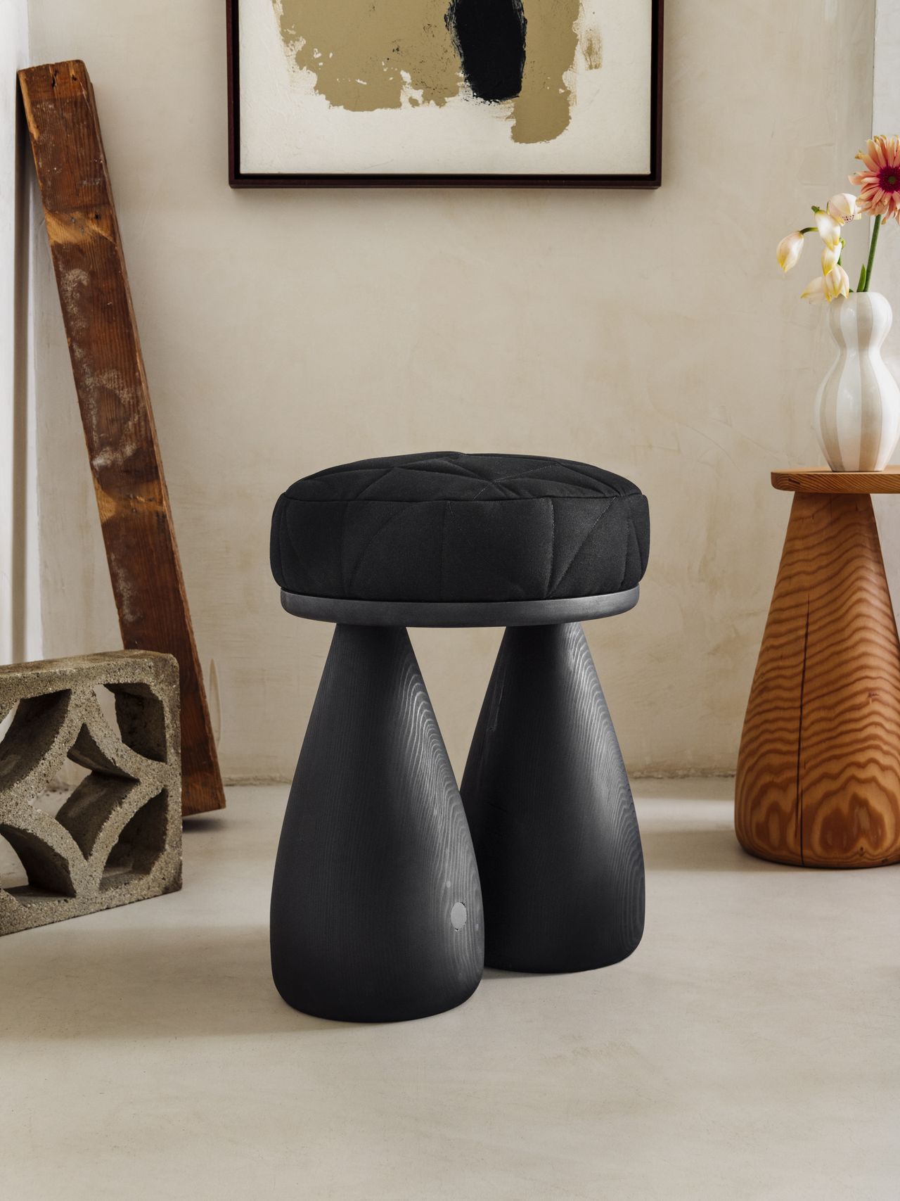 Chunky-looking furniture items including armchairs, chairs, stools, coffee tables, and sofas boast an organic feel and pleasing surface against a cream background.
