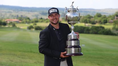 Thriston Lawrence with the Investec South African Open Championship trophy