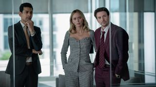 Amit Shah, Emily Blunt and Chris Evans in an office in Pain Hustlers