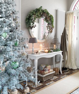 Christmas hallway and entryway with tree and console