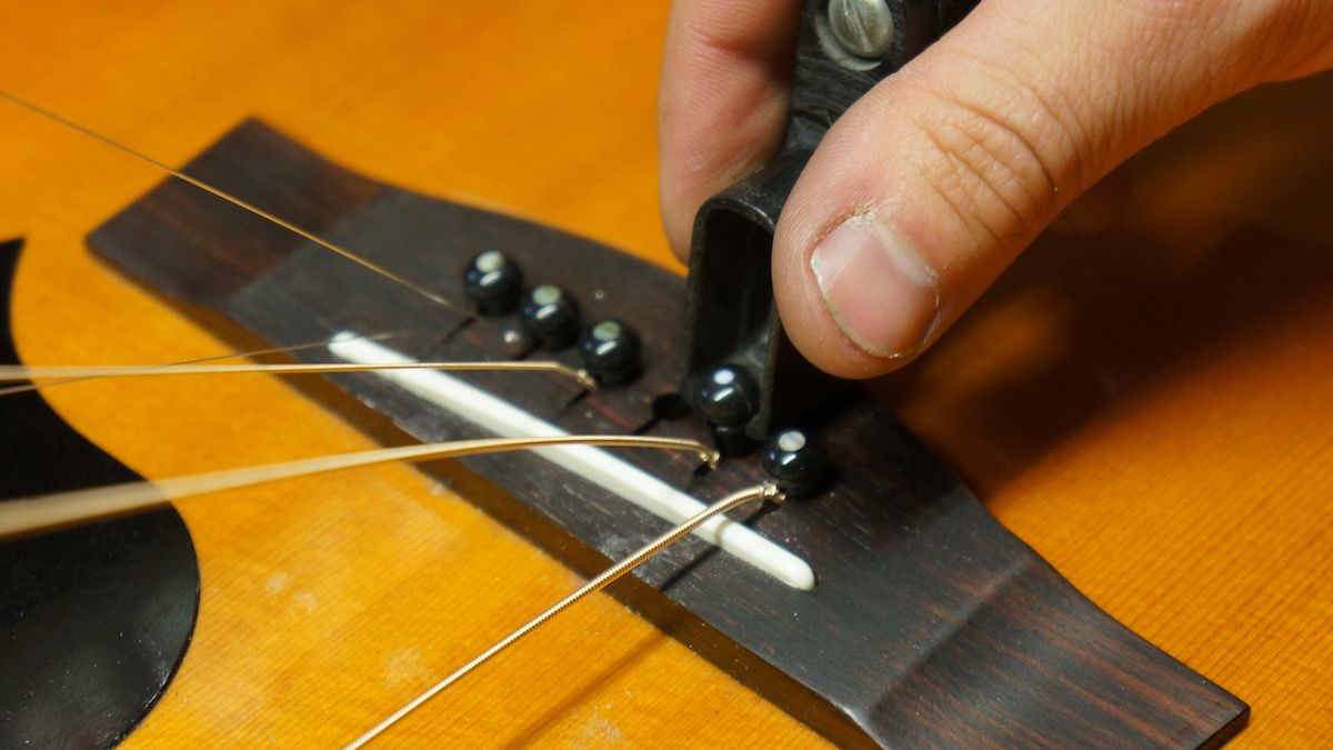 How to restring an acoustic guitar stepbystep guidance from a professional guitar repairer