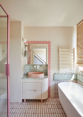 white bathroom with pink fixtures