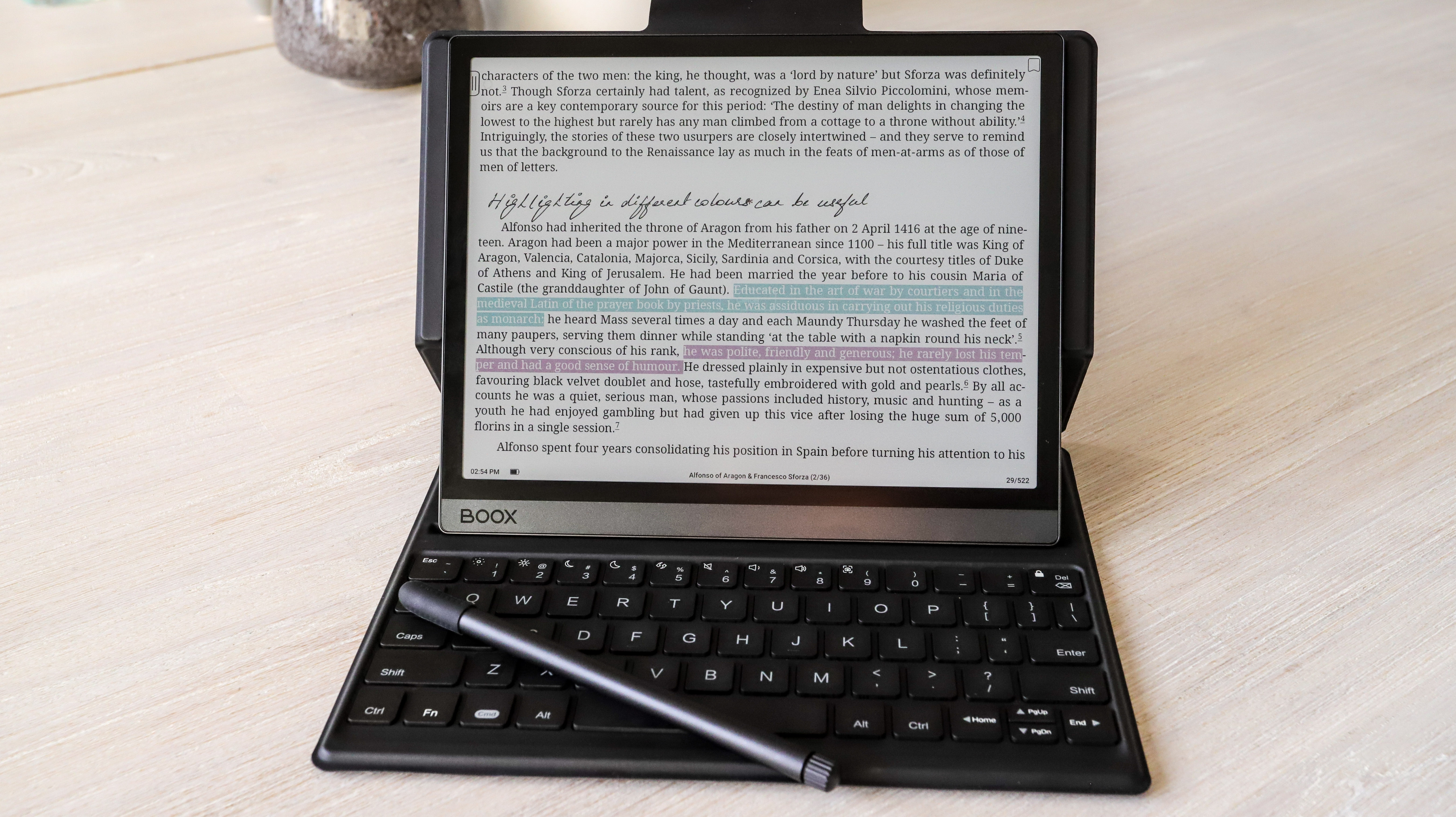 Onyx Boox Tab Ultra C propped on its keyboard case with a highlighted page displayed