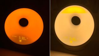 Philips SmartSleep Sleep and Wake-Up Light wake-up light sunrise function. Warm orange and yellow donut-ring light.