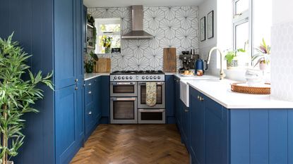 blue kitchen with island and bar stools