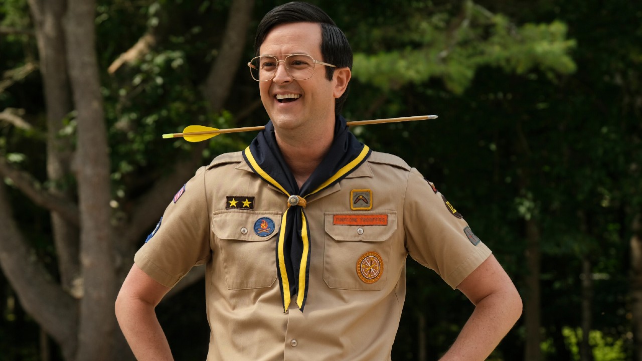 Pete smiling with his hands on his hips and an arrow through his neck on Ghosts.