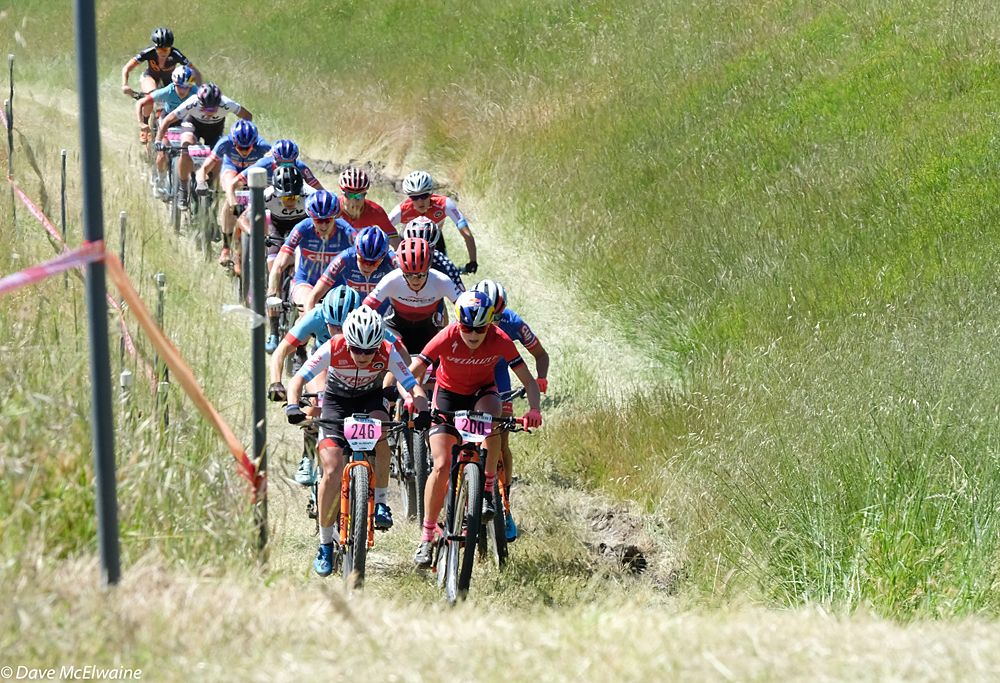 Chloe Woodruff (Stans-Pivot) driving the pace on the grass climb