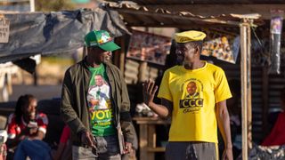 A supporter of the ruling party ZANU PF (left) and a supporter of Citizens' Coalition for Change (CCC) (right) on August 9, 2023 in Harare, Zimbabwe. 