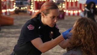 Danielle Savre as Maya Bishop working with a victim in Station 19 season 6