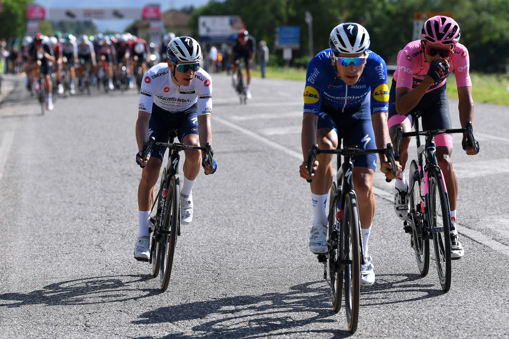 FOLIGNO ITALY MAY 17 Joao Almeida of Portugal and Team Deceuninck QuickStep Remco Evenepoel of Belgium and Team Deceuninck QuickStep white best young jersey Egan Arley Bernal Gomez of Colombia and Team INEOS Grenadiers Pink Leader Jersey during the 104th Giro dItalia 2021 Stage 10 a 139km stage from LAquila to Foligno girodiitalia Giro on May 17 2021 in Foligno Italy Photo by Tim de WaeleGetty Images