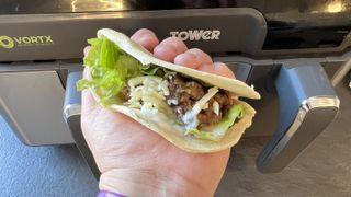 air fryer taco ready to eat in front of air fryer