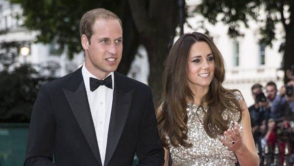 Prince William wearing tux &amp; Kate Middleton wearing evening gown, walking on the red carpet