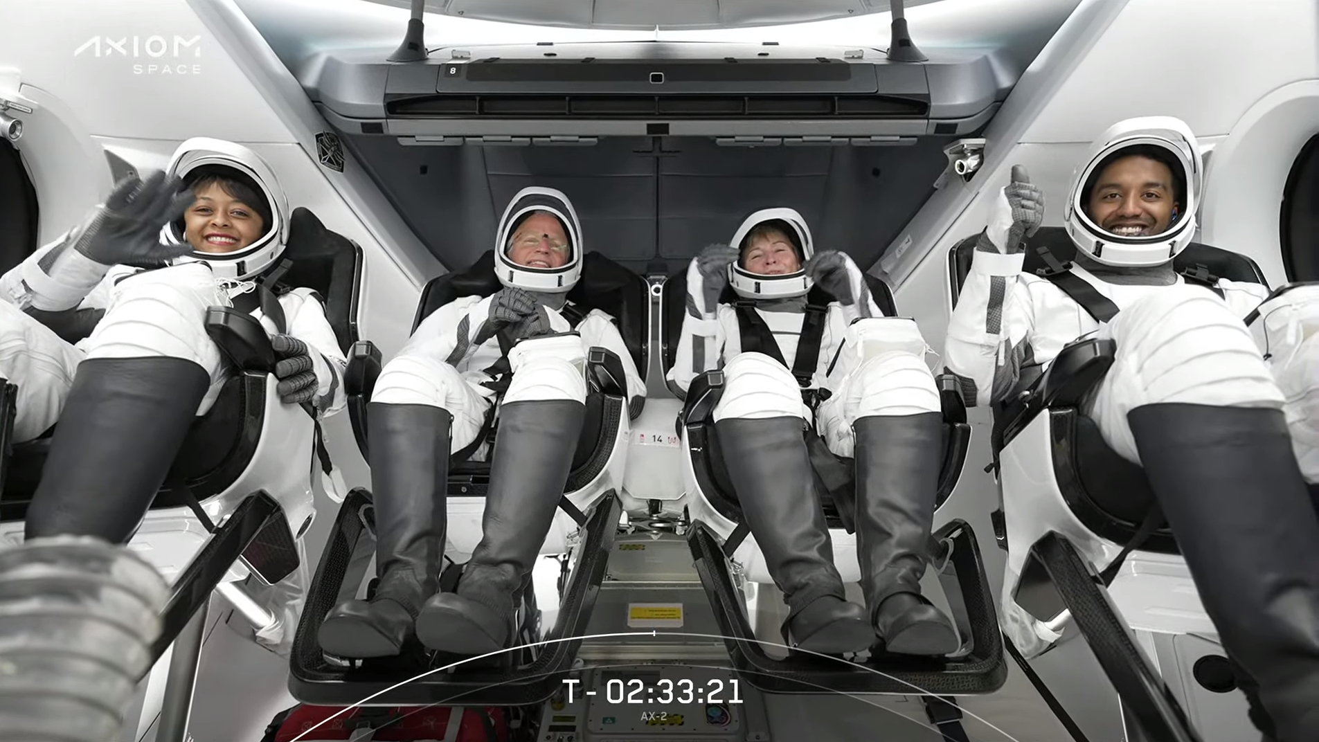 Ax-2 astronauts in spacesuits strapped in inside Dragon capsule Freedom