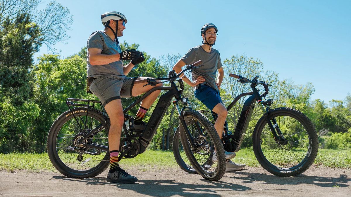 Two people riding MOD Bikes MOD Black ebikes