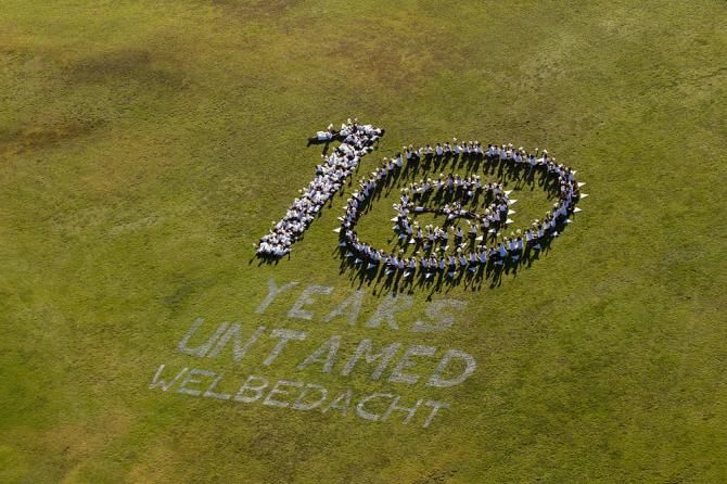 10 Years untamed icon with school kids near Wellington during the Cape Epic