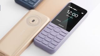 Two Nokia 130 phones in lavender and gold, on white background