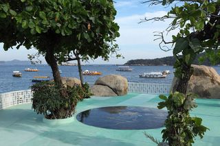 The pool and restaurant boast views across to the Roqueta Island