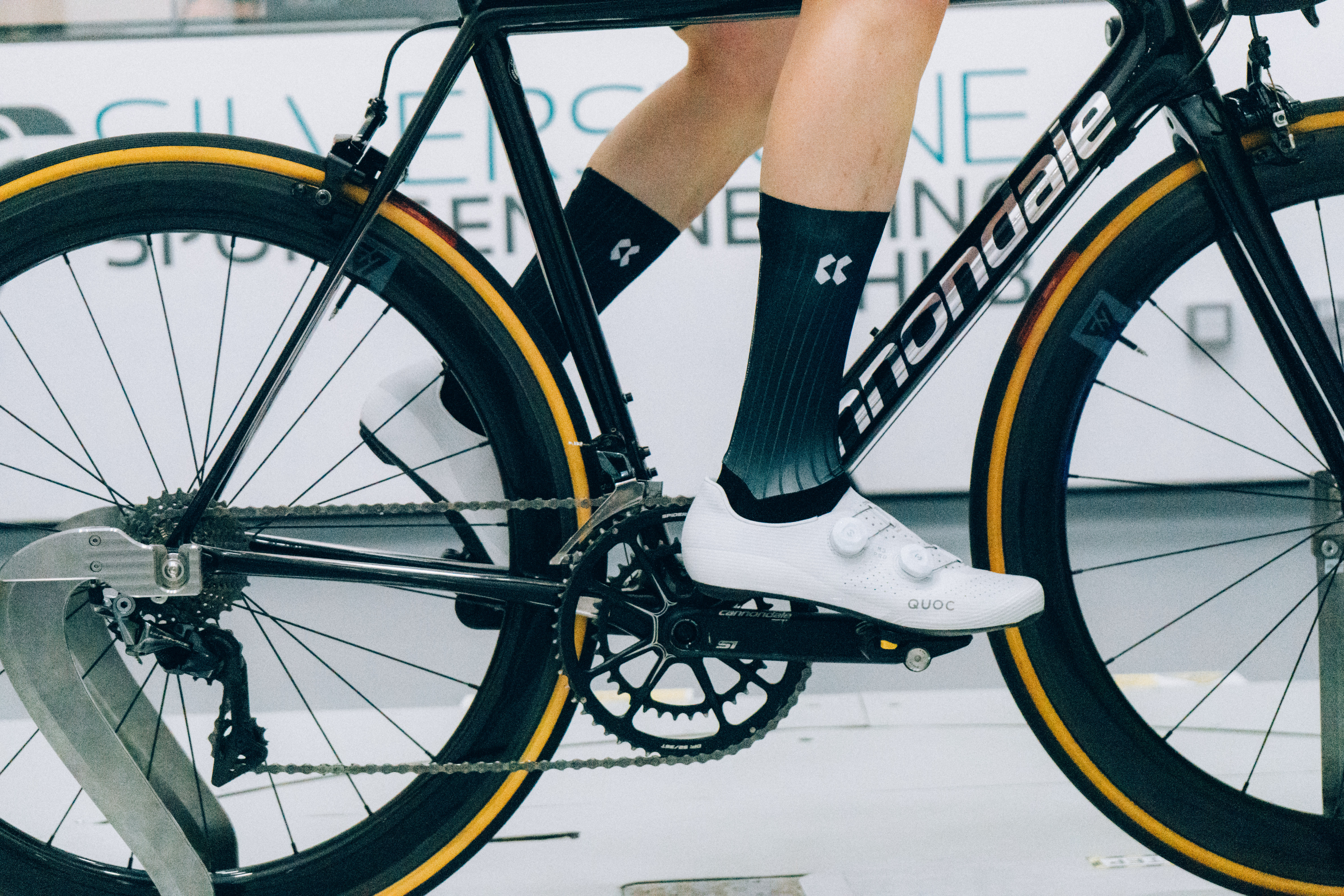 A close up of the socks that Tom is wearing while riding a bike in the wind tunnel