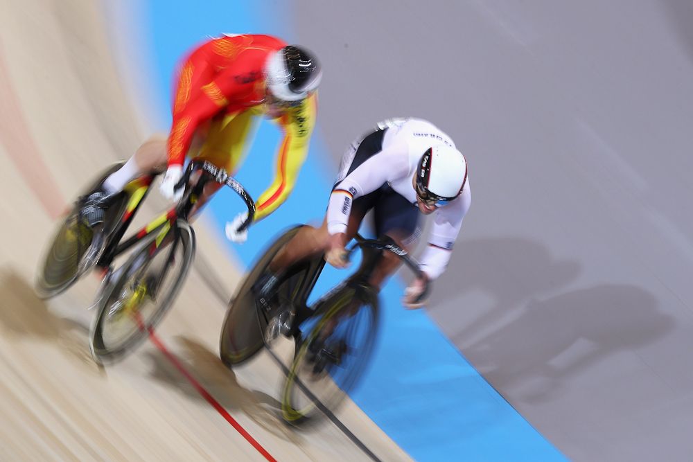 Eric Engler (white helmet) of Germany and Juan Peralta Gascon of Spain compete in the Men's Sprint 1/8 Finals