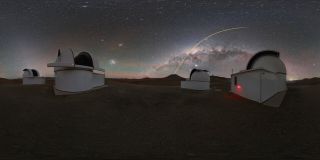 The European Southern Observatory's Very Large Telescope (VLT) beams its laser guide star into the night sky over Chile, creating a beam of light that arcs above the Milky Way galaxy. Astronomers use giant laser beams like these to help their telescopes correct for the distortion caused by turbulence in Earth's atmosphere, which can make stars appear to twinkle. For observations at the VLT, astronomers rely on the Laser Guide Star Facility at the Paranal Observatory in Chile. Pictured in the foreground are three domes of the SPECULOOS Southern Observatory.