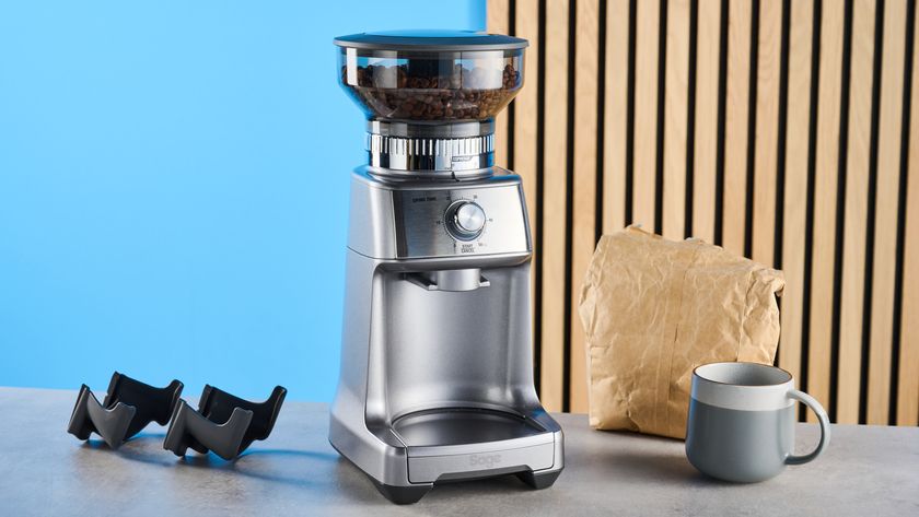 the breville dose control pro, called sage dose control pro in the uk, a silver coffee grinder with 60 grind settings and labeled grind size adjustment