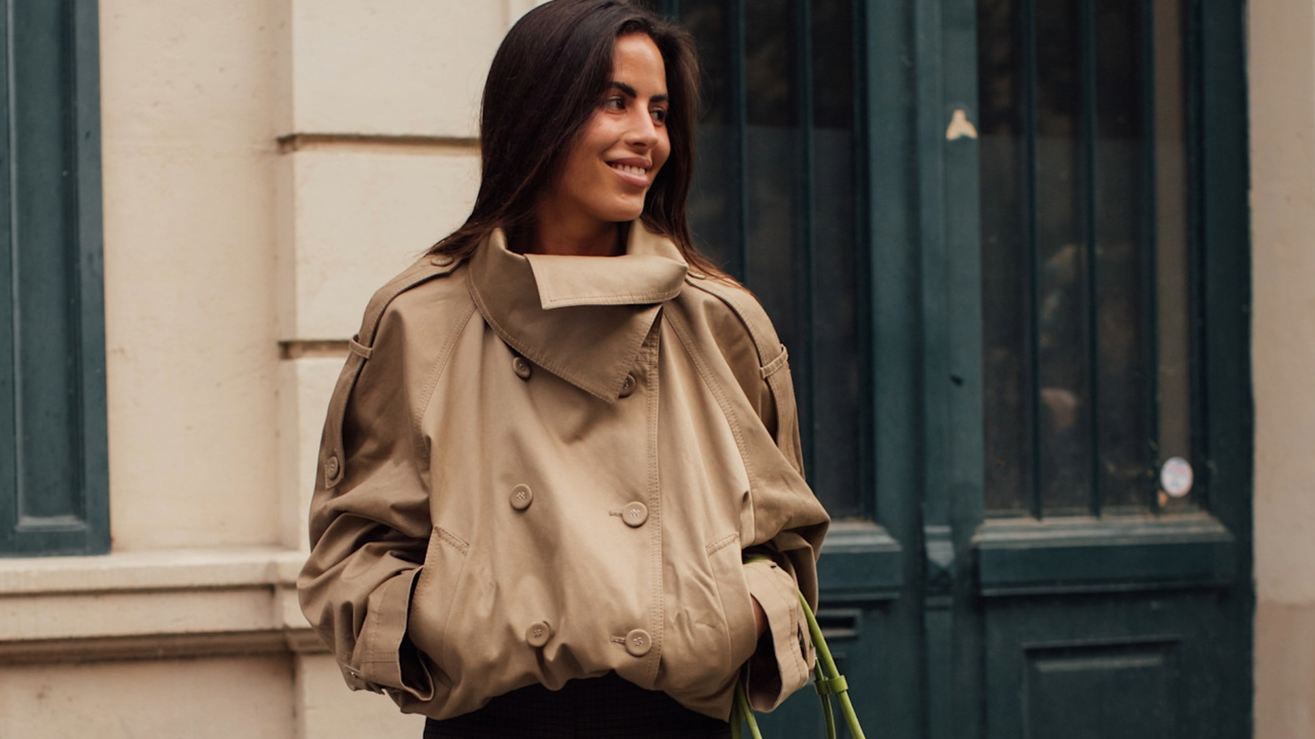 woman wearing a tan trench coat 