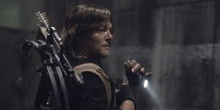daryl with a flashlight in the sewer on the walking dead season 11