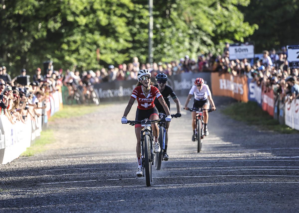 Jolanda Neff (Trek Factory) starts to celebrate victory at the XCC race of the UCI MTB World Cup Mont-Sainte-Anne