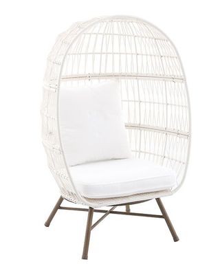 A white egg chair made from steel and wicker with olefin fabric cushions