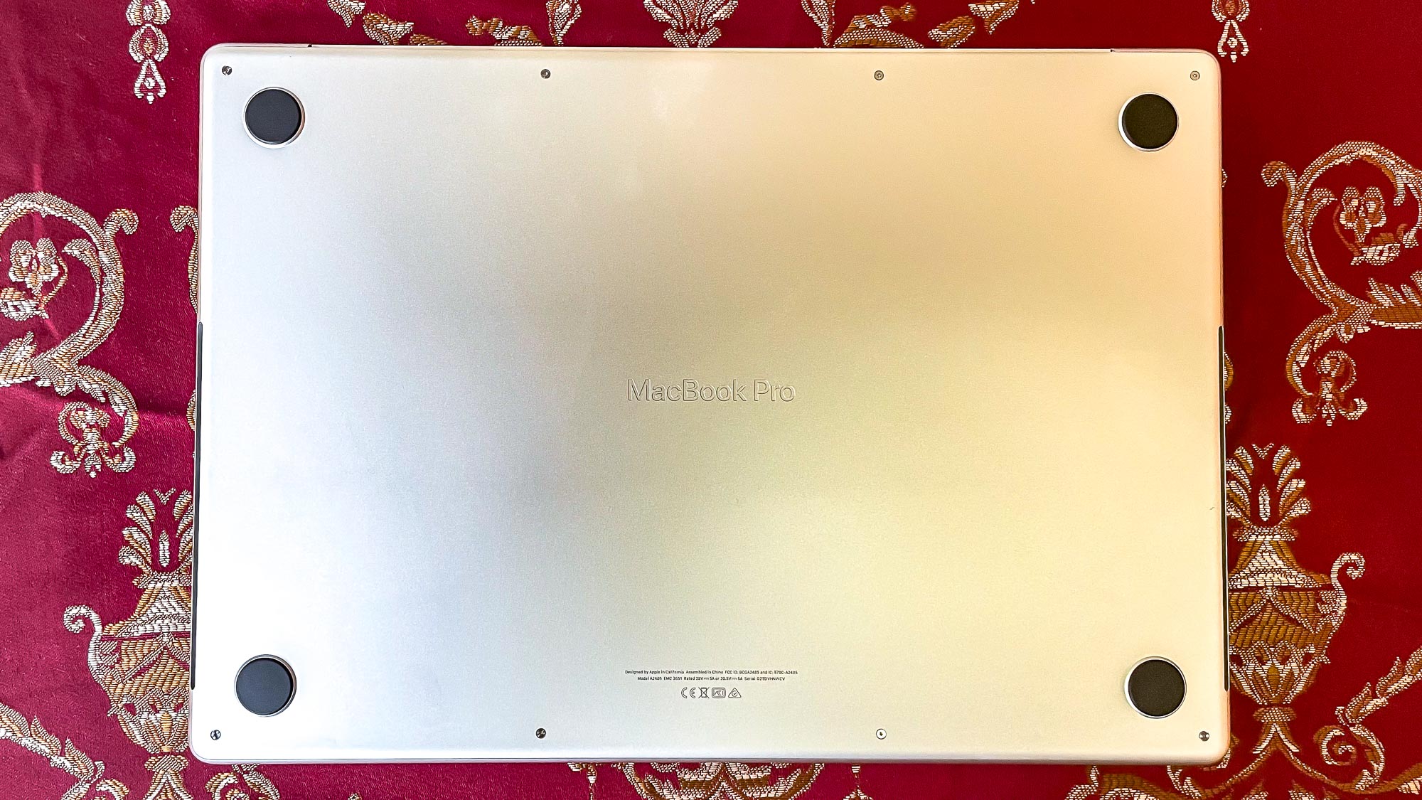 MacBook Pro 2021 (16-inch) on a table, flipped upside down