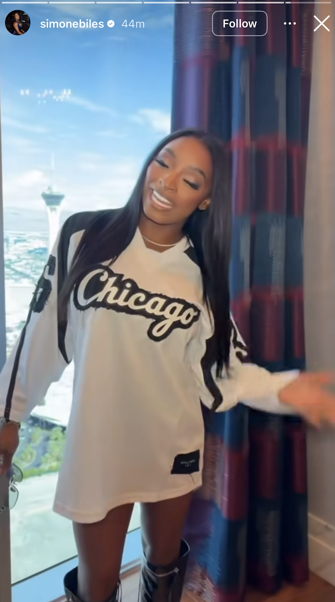 Simone Biles with long, straight black hair