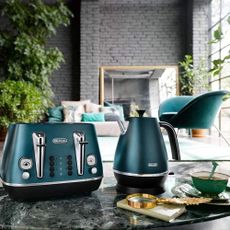 dark green kettle with arm chair