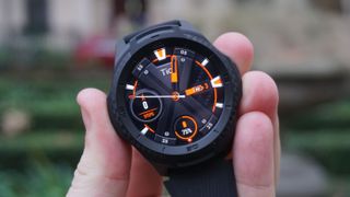 A TicWatch S2 in someone's hand